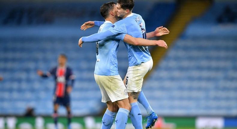 Manchester City's John Stones and Ruben Dias celebrate Creator: Paul ELLIS