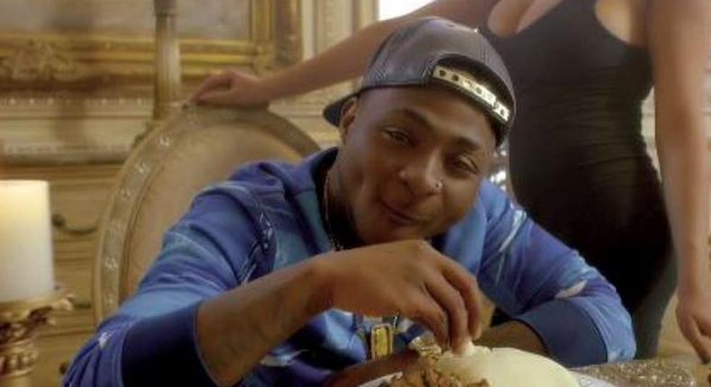 Davido eating fufu