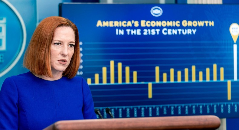 A monitor displays a graph showing American economic growth in the 21st century as White House press secretary Jen Psaki speaks at a press briefing at the White House in Washington, Thursday, Jan. 27, 2022.