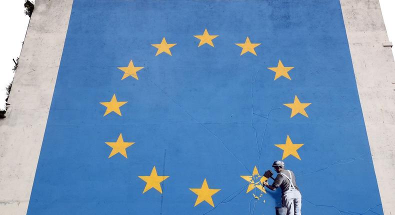 A view of a mural by artist Banksy of a workman removing a star from the EU flag which appeared yesterday near the ferry terminal in Dover, Kent.
