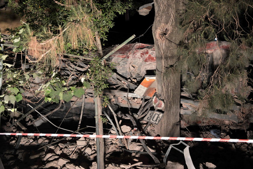 A derailed train carriage is seen toppled in the town of Adendro in northern Greece