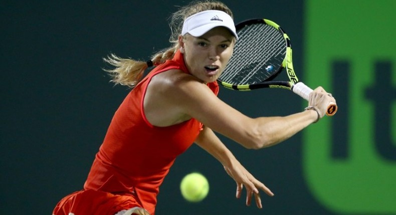 Caroline Wozniacki of Denmark returns a shot to Lucie Safarova of Czech Republic during their WTA Miami Open quarter-final match, at the Crandon Park Tennis Center in Key Biscayne, Florida, on March 28, 2017