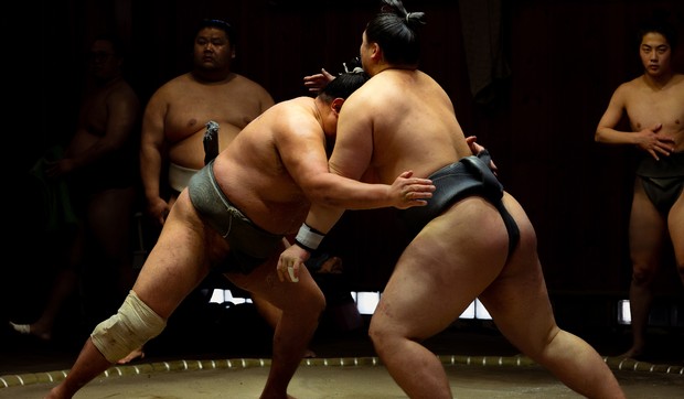 Shadows of Strength: Sumo Wrestlers Face Off in Low Key Training