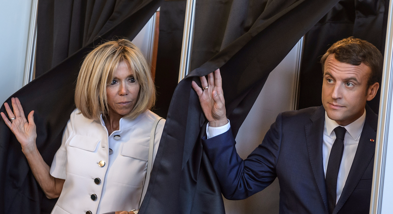 French President Emmanuel Macron and his wife, Brigitte, voting in the first of two rounds of parliamentary elections in Le Touquet, France, on June 11. Macron's party won a clear parliamentary majority on Sunday.