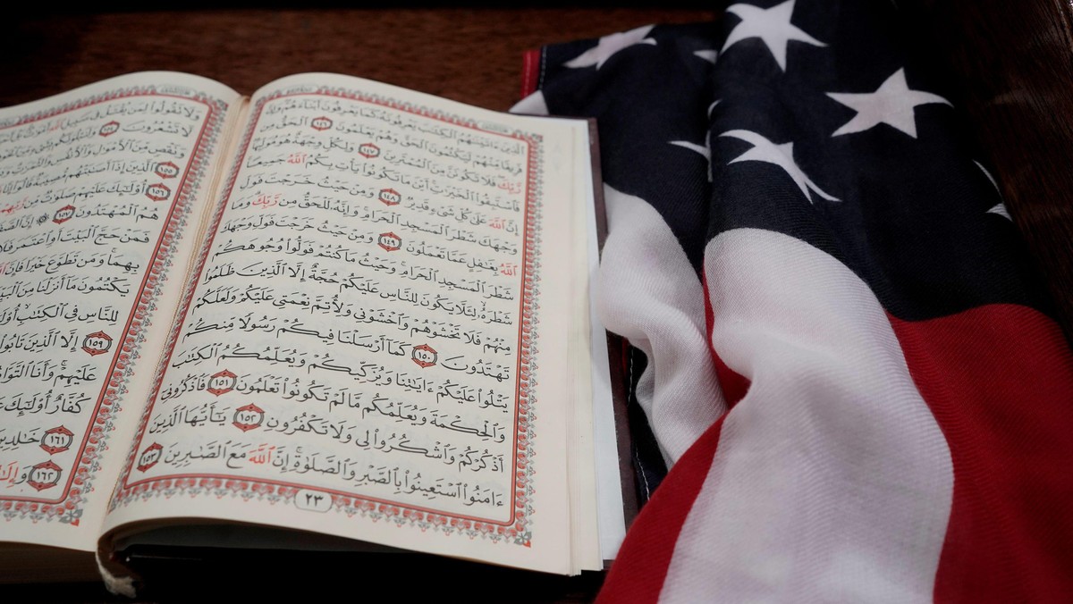 The Koran and and the U.S. flag are seen on the podium before a vigil in honor of New Zealand mosque attack victims at Dar Al-Hijrah Islamic Center in Falls Church