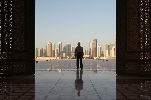 Man stands at Imam Muhammad ibn Abd al-Wahhab Mosque in Doha