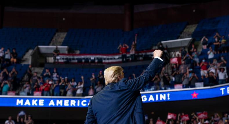 President Donald Trump arrives on stage to speak at a campaign rally at the BOK Center, Saturday, June 20, 2020, in Tulsa, Okla. (AP Photo/Evan Vucci)