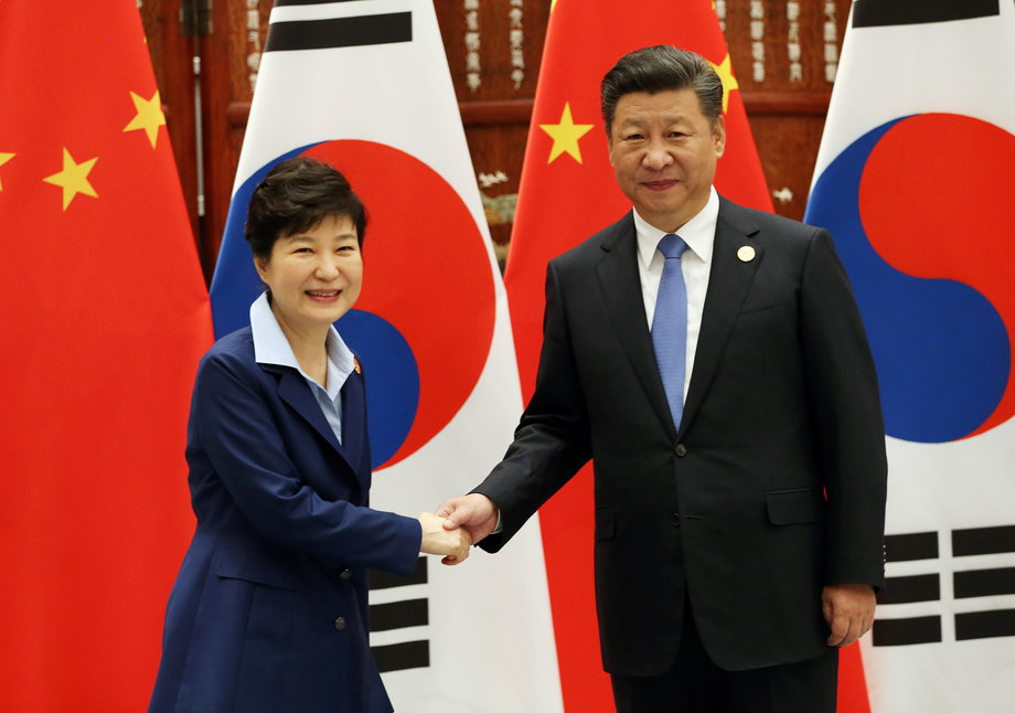 South Korean President Park Geun-hye shakes hands with Chinese President Xi Jinping at the G-20 Summit.