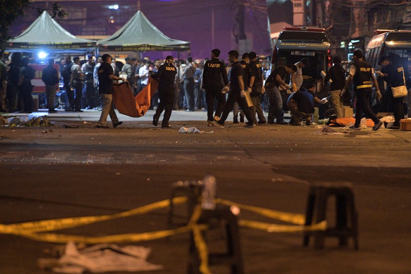 Police secure the area following an explosion at a bus stop in Kampung Melayu, East Jakarta, Indones