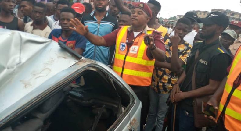 Two people escape death in Onitsha as containers fall on vehicle. [NAN]