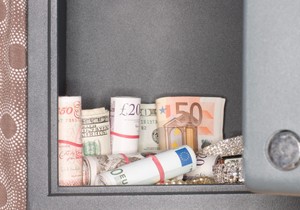 Money and jewelry inside a safe
