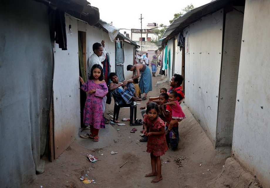 FILE PHOTO: People belonging to Rohingya Muslim community sit outside their makeshift houses on the outskirts of Jammu