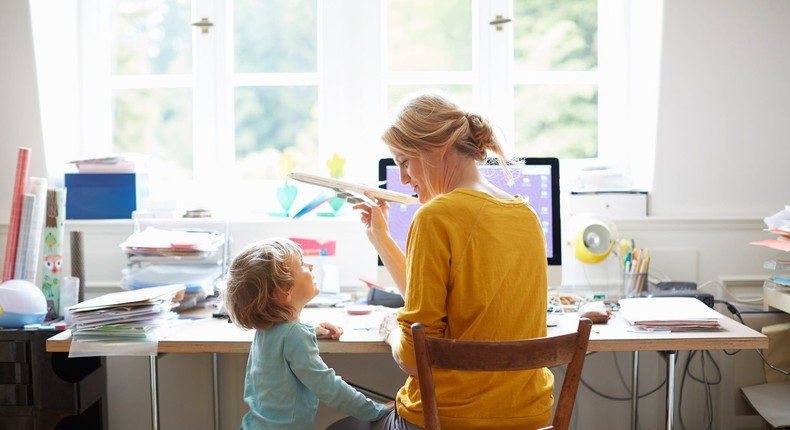 woman working at home with child