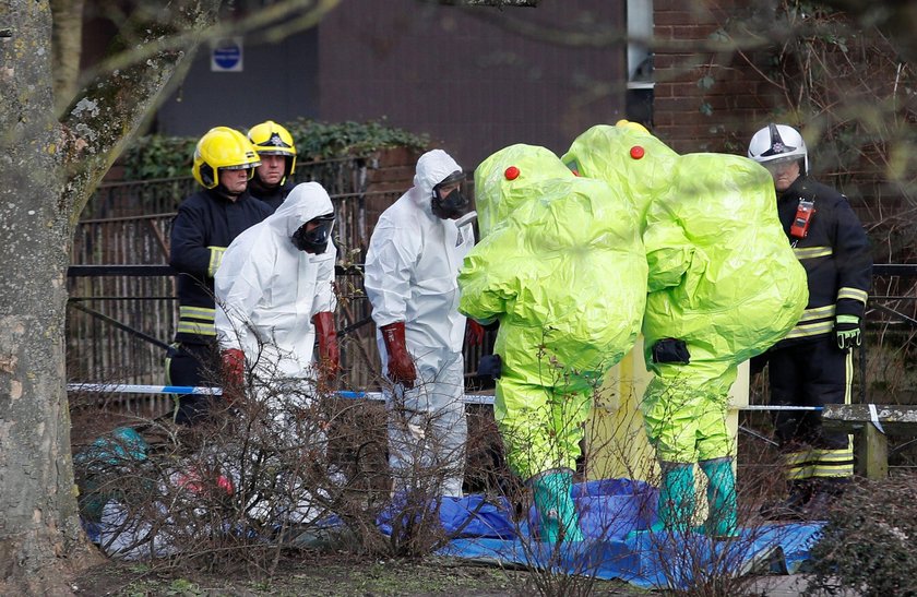 Police officers continue to guard the scene where a forensic tent, covering the bench where Sergei S