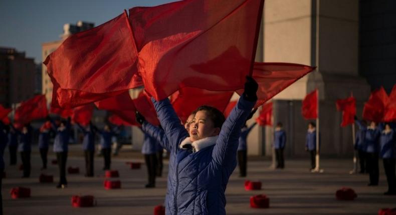 A propaganda troupe signals the last day of a mass mobilisation campaign that started in early June