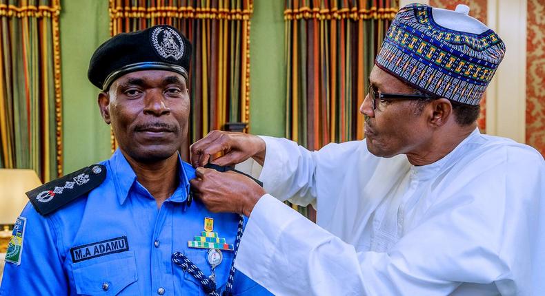 The Inspector-General of Police, Mohammed Adamu (left), says Shiites are no longer allowed to protest after the President Muhammadu Buhari-led government secured a court order to declare the Islamic Movement in Nigeria (IMN) a terrorist organisation [Twitter/@NGRPresident]