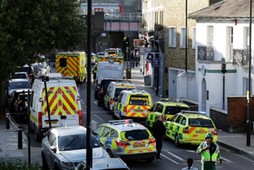 Police vehicles line the street near Parsons Green tube station in London