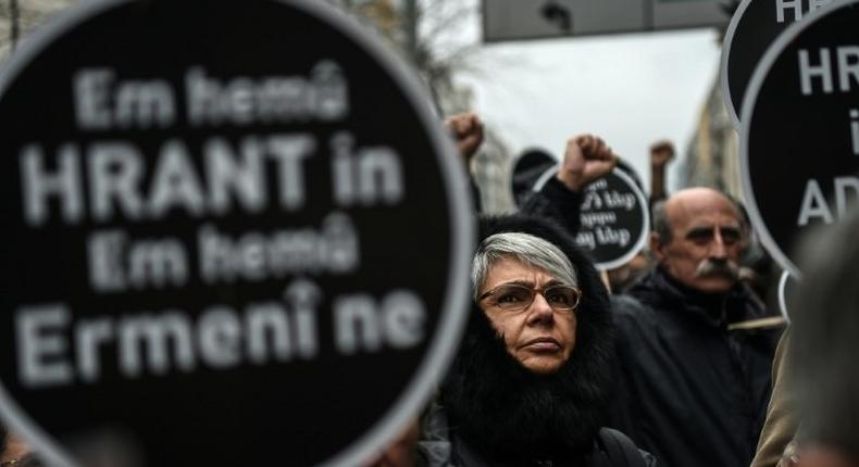Crowds in Istanbul hold placards reading 'We all are Hrant, we all are Armenians on January 19, 2017, to mark the 10th anniversary of the killing of Turkish-Armenian journalist Hrant Dink