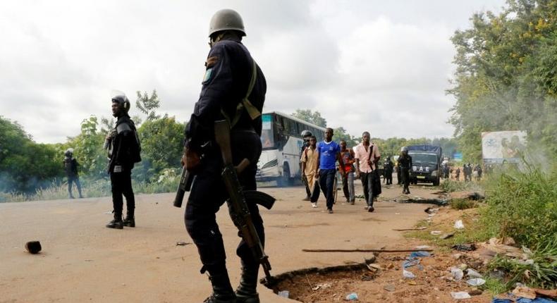 Four people were killed when police clashed May 23 with former rebels who had blocked the road into Bouake, Ivory Coast's second biggest city, to demand government compensation payments