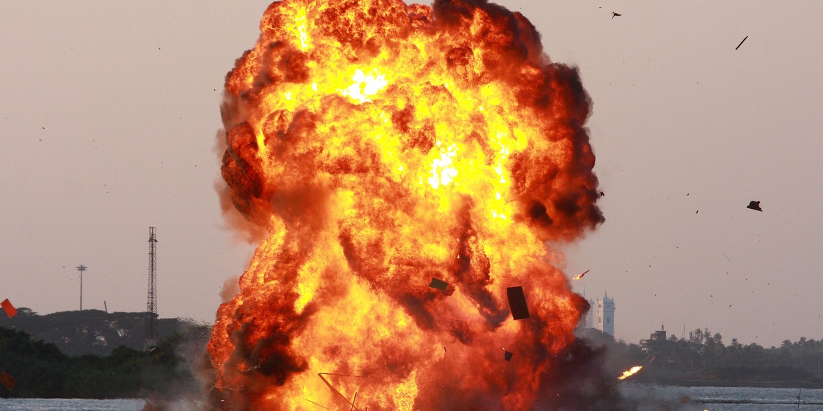 Indian Marine Commandos display the execution of a sabotage operation on a simulated oil rig in the Indian city of Kochi on December 12, 2010.