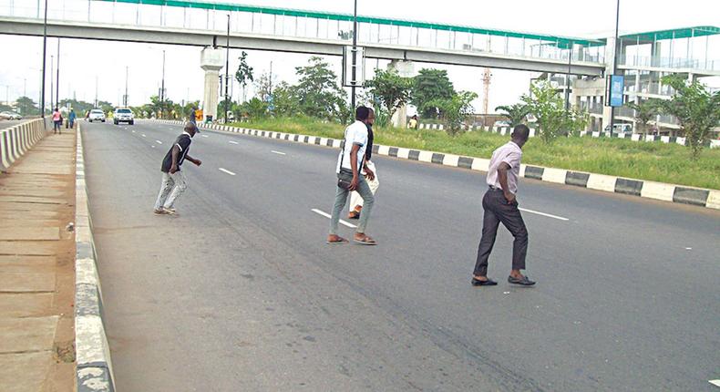 Crossing expressways in Lagos [The Guardian Nigeria]