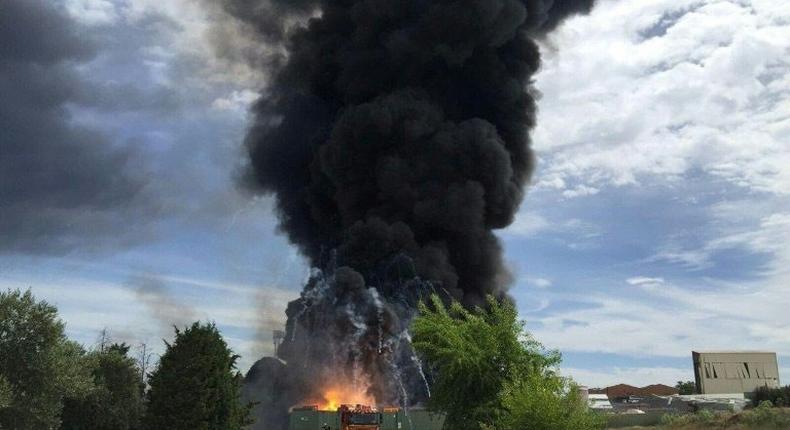 Black smoke billows after an explosion at a warehouse containing hazardous chemical waste near Madrid on May 4, 2017