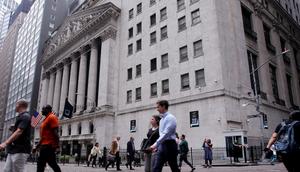 People walk near the New York Stock Exchange.Leonardo Munoz/VIEWpress via Getty Images