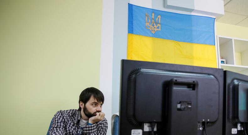 A specialist of IT company Infopulse is seen in his office in Kyiv, Ukraine.
