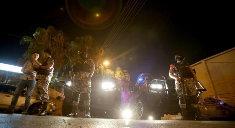 Jordanian security forces stand guard outside the Israeli embassy in Amman following an 'incident' on July 23, 2017 in which a Jordanian man was killed and an Israeli seriously injured