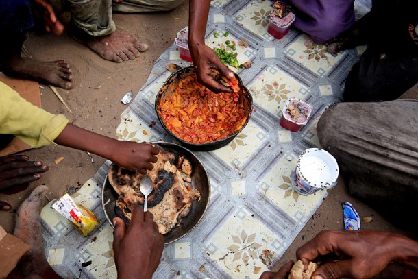 The Wider Image: Displaced Yemeni family sift through garbage for food