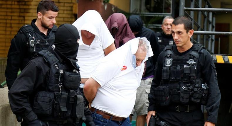 People detained during the probe known as Operation Weak Flesh leave the Institute of Forensic Science in Curitiba, Brazil, March 17, 2017.