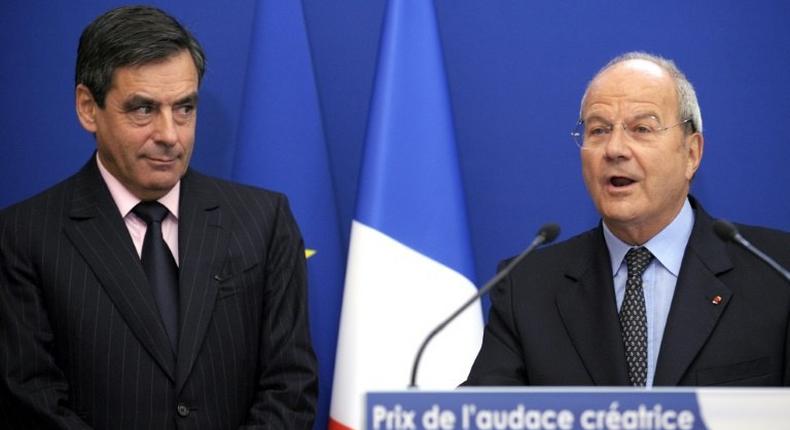 Francois Fillon (left) listens to Marc Ladreit de Lacharriere during a 2009 award ceremony in Paris