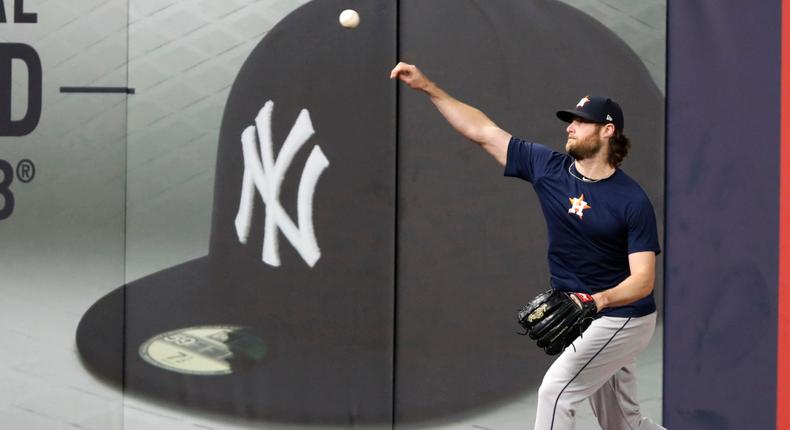 FILE - In this Monday, Oct. 14, 2019, file photo, Houston Astros Game 3 starting pitcher Gerrit Cole throws on the field at Yankee Stadium in New York, after the team arrived to prepare for the American League Championship Series, against the New York Yankees. Cole and the New York Yankees have agreed to a record $324 million, nine-year deal, a person familiar with the contract told The Associated Press, late Tuesday, Dec. 10, 2019. (AP Photo/Kathy Willens, File)