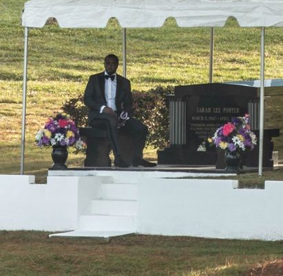 Diddy is spotted at the graveside where ex-girlfriend Kim Porter was buried. 
