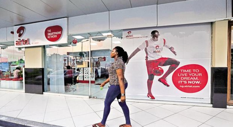 A customer walks pass an Airtel store in Nigeria