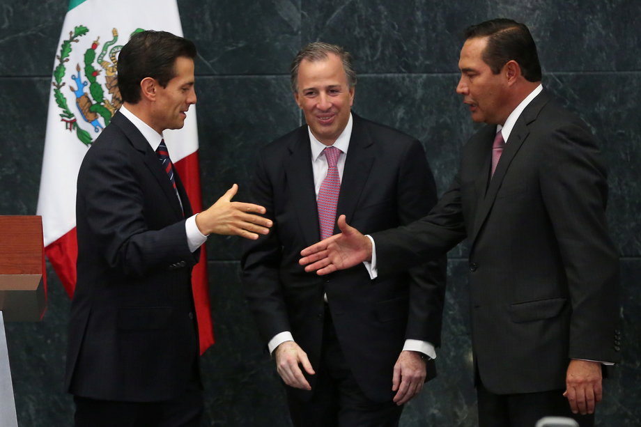 Mexico's President Enrique Pena Nieto with new Minister of Social Development Luis Enrique Miranda Nava and new Finance Minister Jose Antonio Meade, center, during the announcement of new cabinet members in Mexico City, September 7, 2016.