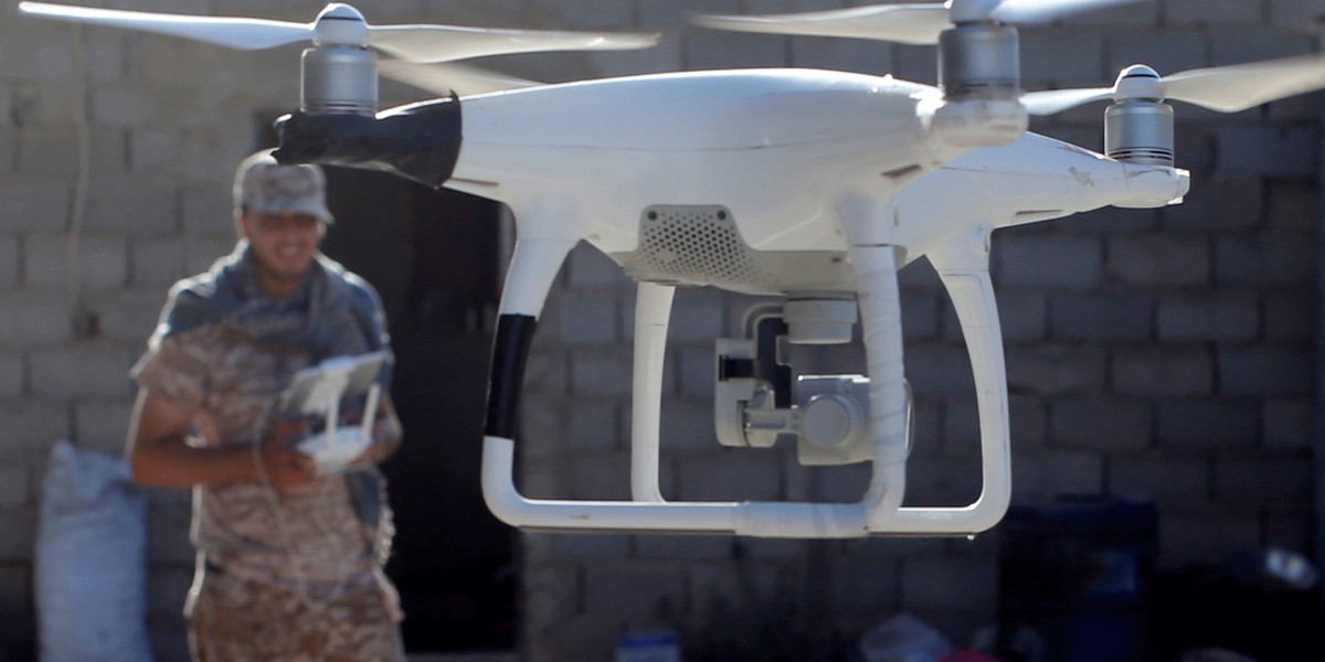 A fighter of Libyan forces allied with the UN-backed government seen with a drone used to observe Islamic State fighters positions in Sirte, Libya.