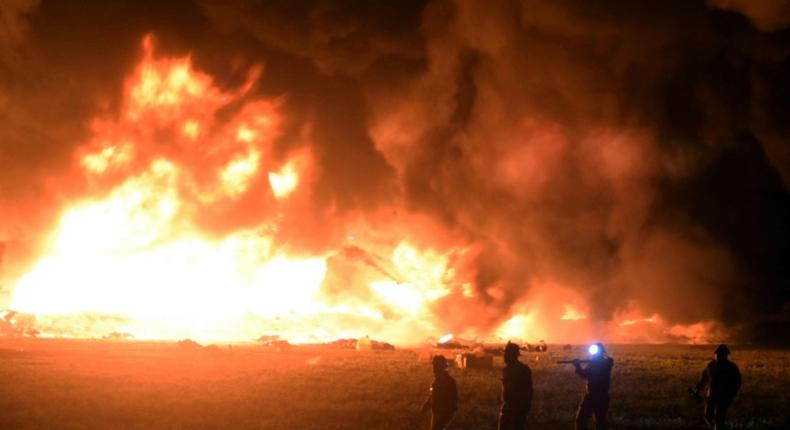 Flames burn at the scene of a massive blaze triggered by a leaky pipeline in Tlahuelilpan, Hidalgo state, on January 18, 2019