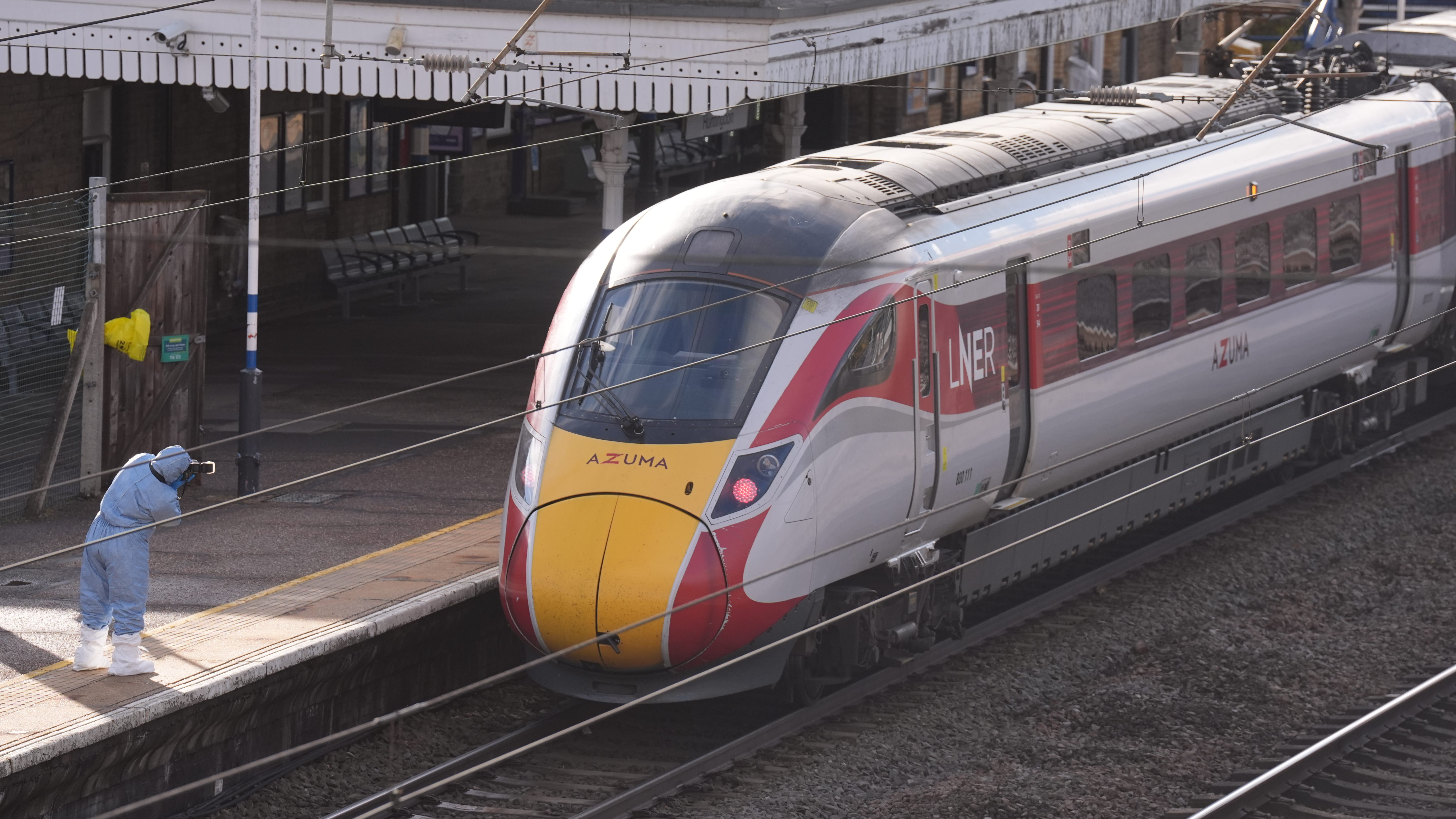 Railway worker fights for life after stopping train knife attack - 11 hurt