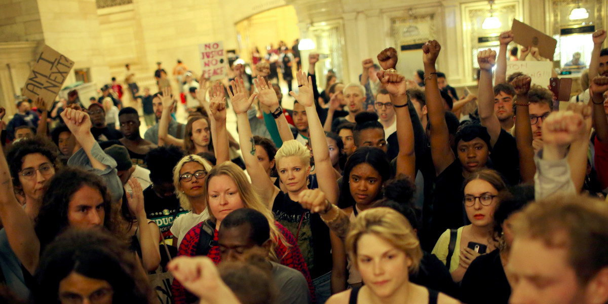 People go into Grand Central Station while they take part in a protest against the killing of Alton Sterling, Philando Castile and in support of Black Lives Matter during a march along Manhattan's streets in New York July 8, 2016.