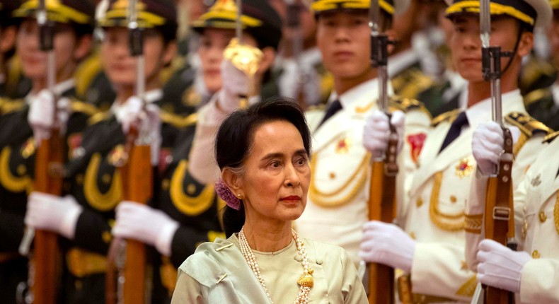 Myanmar's State Counselor Aung San Suu Kyi reviews an honor guard during a welcome ceremony at the Great Hall of the People in Beijing, Thursday, Aug. 18, 2016.