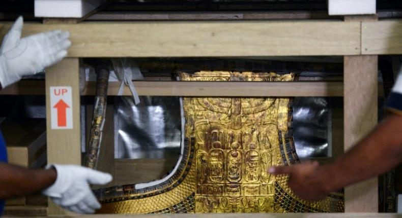 The chariot of the ancient Egyptian boy-king Tutankhamun is revealed after being delivered to its new home, the Grand Egyptian Museum, on May 23, 2017