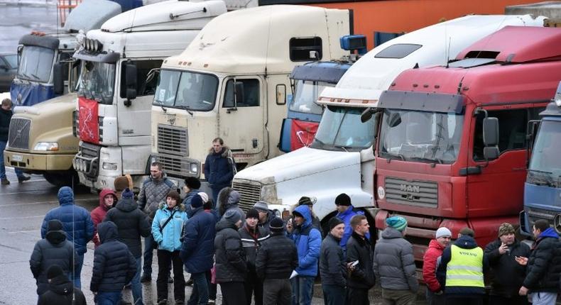 Russian long-distance truck drivers gather at a parking in Khimki, outside Moscow, on December 4, 2015, to protest against the Platon truck taxation system, a system against which truckers have launched a new protest