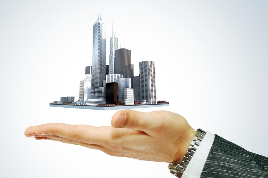 Business city center in businessman's hand