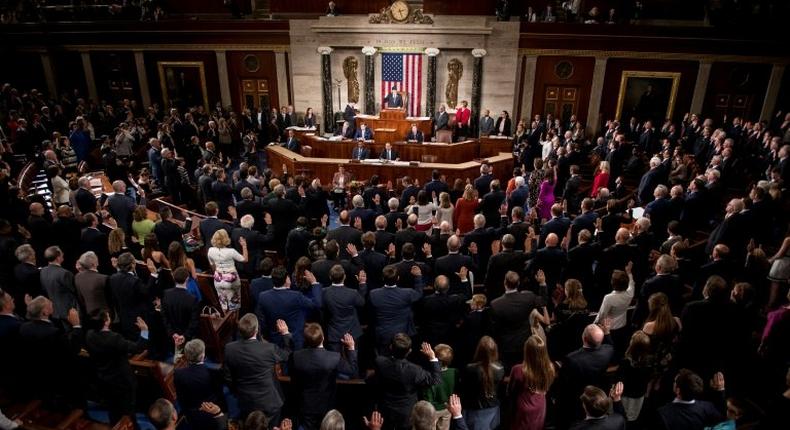 Speaker of the House Paul Ryan (C) swears in the newly elected members of the House of Representatives during the opening of the 115th US Congress on January 3, 2017