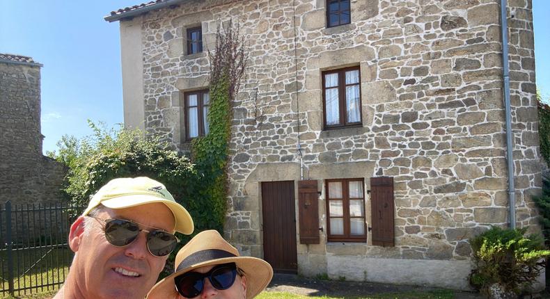 Michael and April Meyer posing in front of their stone cottage in the French countryside.Michael and April Meyer/@FrenchStoneHouseLife
