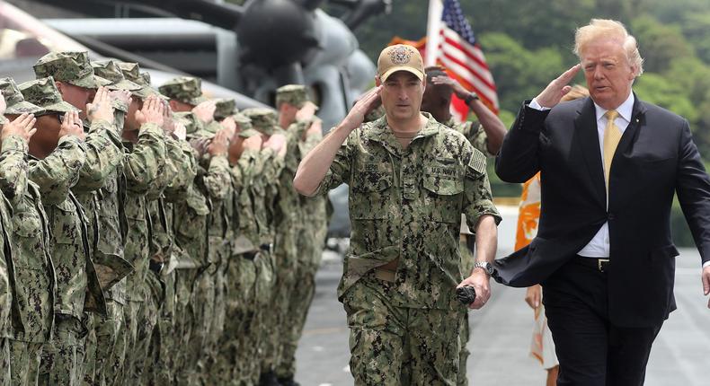 President Donald Trump salutes troops aboard the USS Wasp in Yokosuka, south of Tokyo, Japan.
