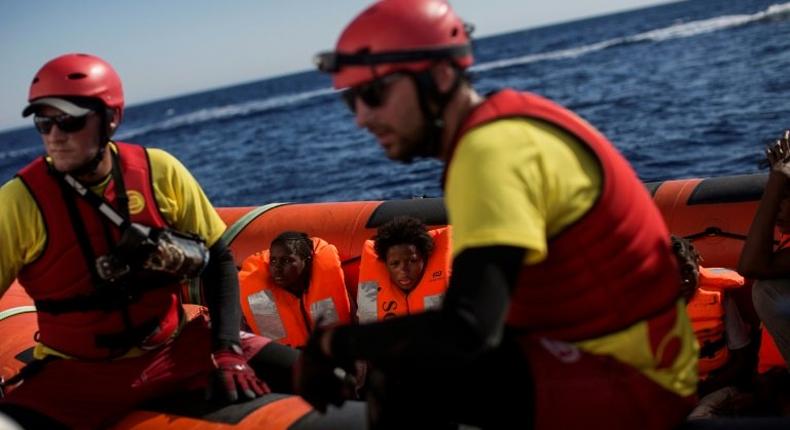 Migrants aboard a Proactiva Open Arms NGO boat following an operation in the Mediterranean Sea