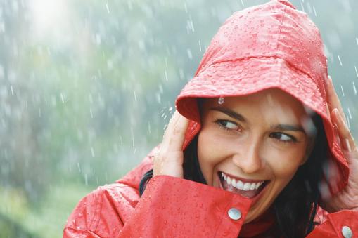 Woman smiling while out in rain