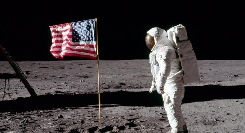 Apollo 11 astronaut Buzz Aldrin stands next to a flag on the moon on July 20, 1969.